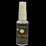 A clear spray bottle labeled TKTX Numb Spray, intended for use during tattoo sessions to numb the skin.