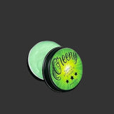 A container of Greeny tattoo aftercare cream with a green lid, displaying the product labeling and branding.