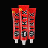 Three red tubes of TKTX cream