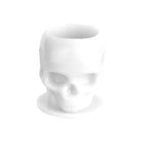 White skull-shaped mug on a white background